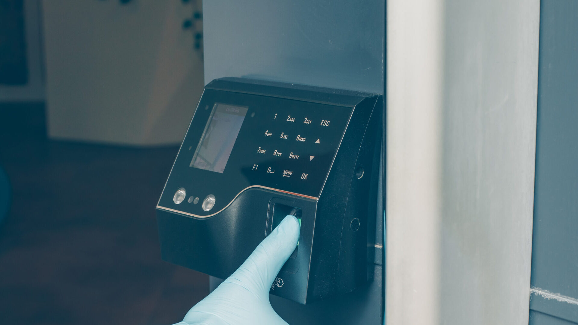 man-getting-intercom-read-his-fingerprint-open-door-with-gloves